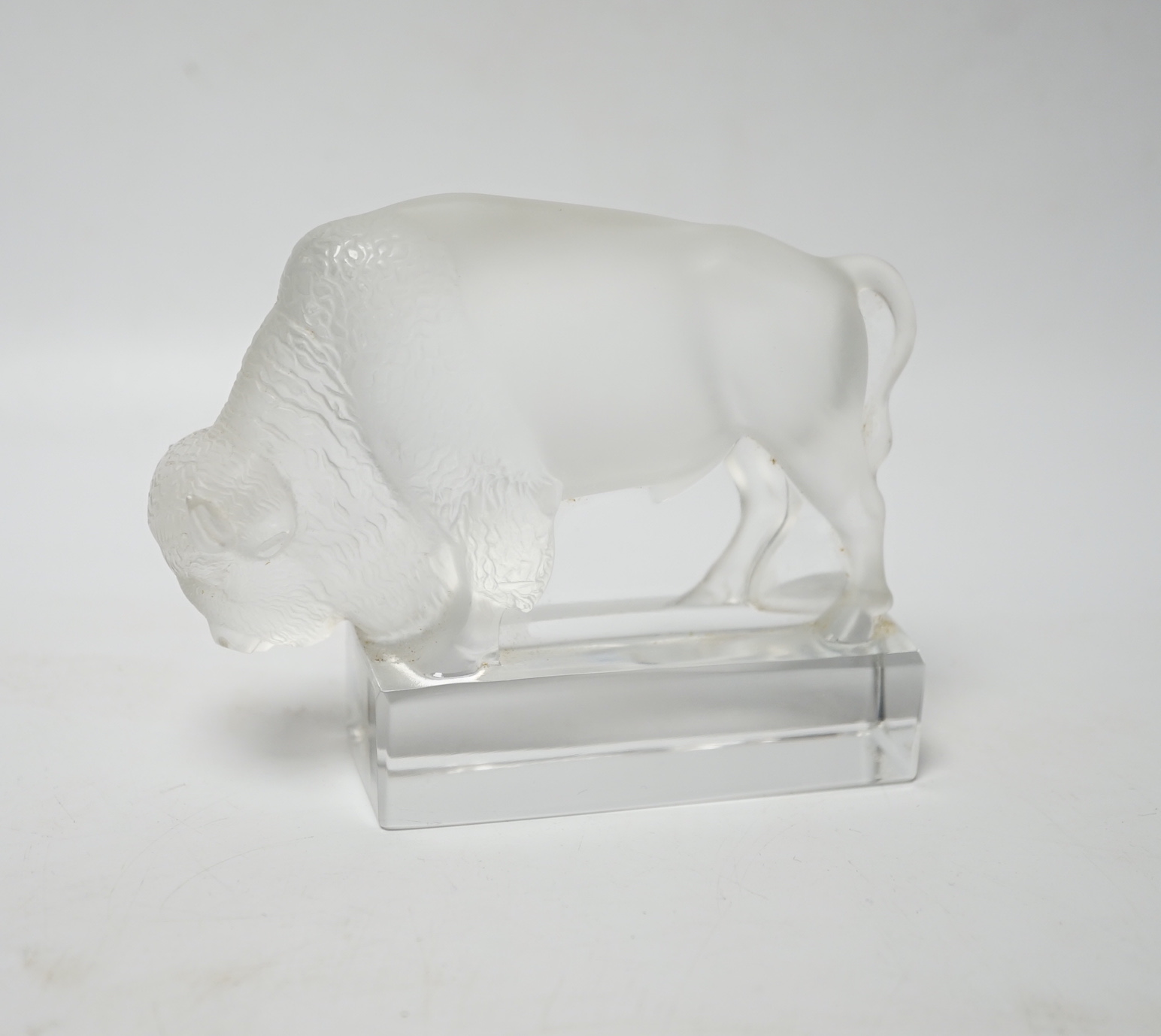 Rene Lalique, a frosted glass paperweight modelled as a bison, signed ‘Lalique France’ to base 12.5cm wide